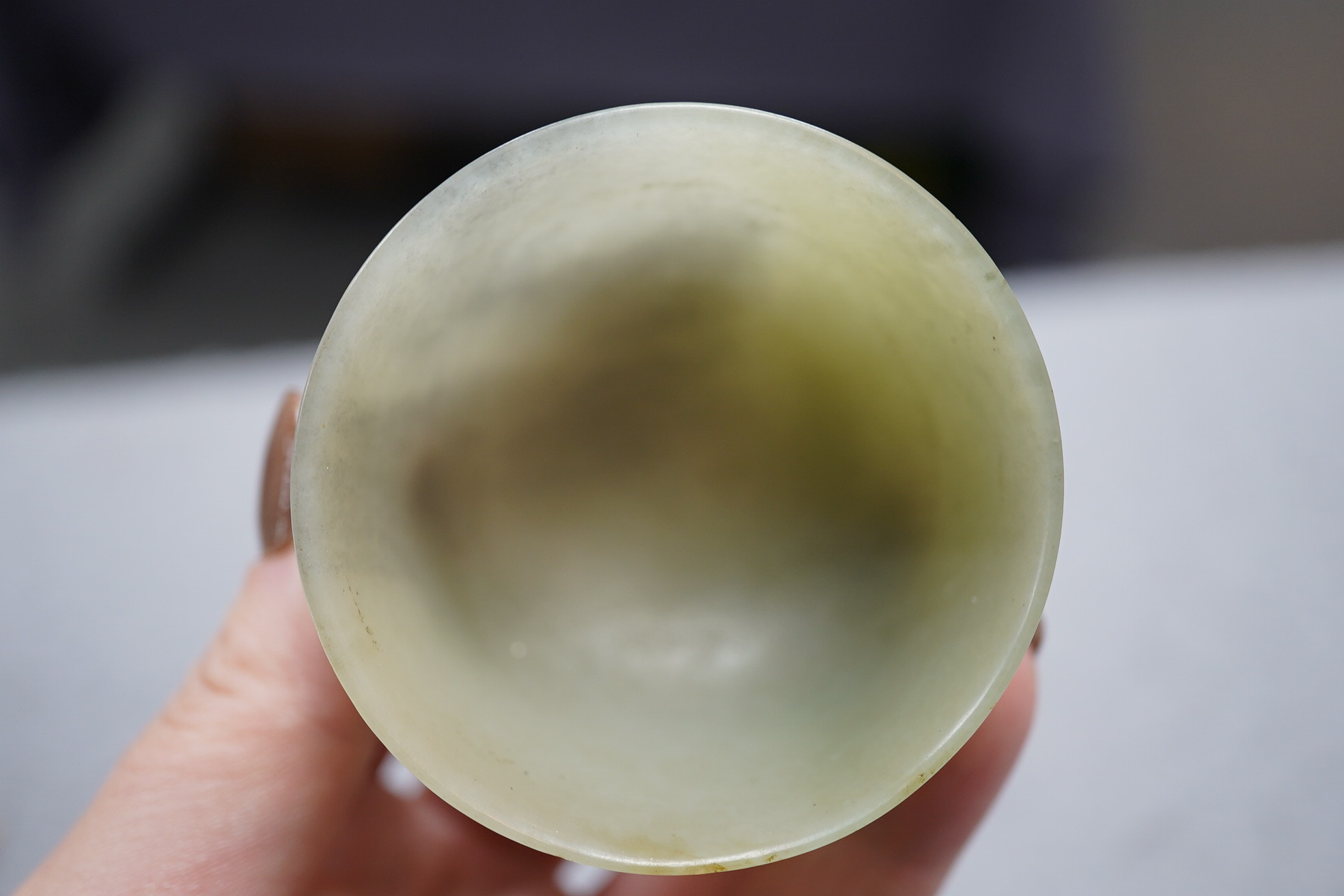 A Chinese pale celadon jade cup, 18th / 19th century